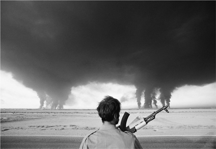 After an attack by Iraq an Iranian soldier watches fires at the Abadan - photo 4