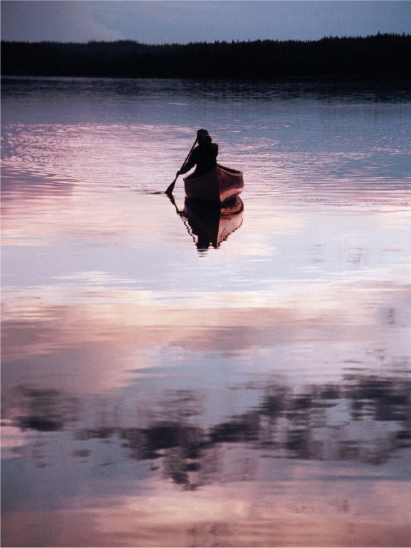 Evening paddle on Smoke Lake in Ontarios Algonquin Provincial Park WAYNE GRADY - photo 1