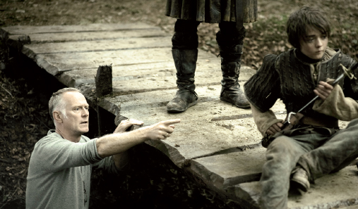 Director Alan Taylor blocks out a scene with Maisie Williams One of - photo 9