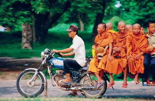 Buddhist monks travelling by motorcycle taxi Siem Reap BERNARD NAPTHINELONELY - photo 3