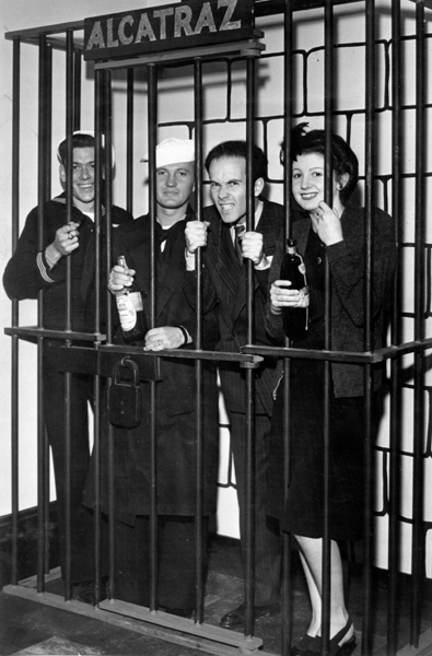 Group posing in a fake prison cell labeled Alcatraz 1944 Title page Aerial - photo 3