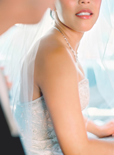 The bride and groom were in their getaway car so I cropped in close to get her - photo 1