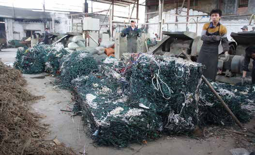 Bales of imported US Christmas tree lights ready to be recycled at Raymond - photo 4