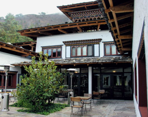 The three-story main building in vernacular style Address Uma Paro PO Box - photo 16