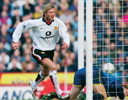 Beckham scores the opening goal during the league match between Villa and - photo 2