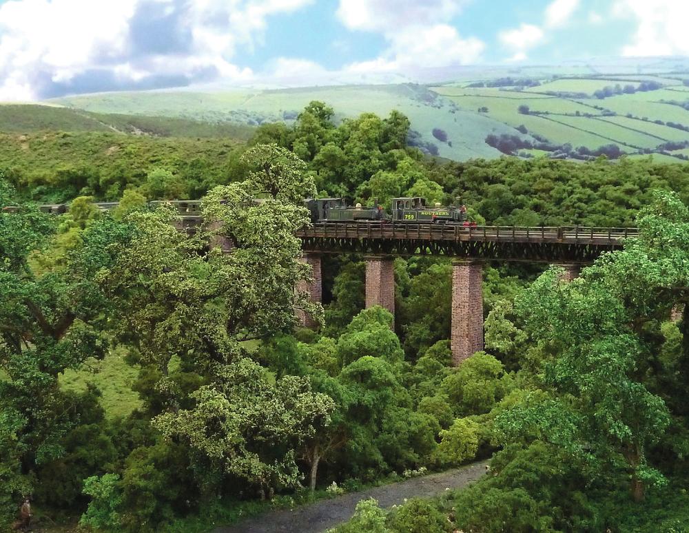 A double-headed train creeps along the East Lyn Viaduct on the authors County - photo 2