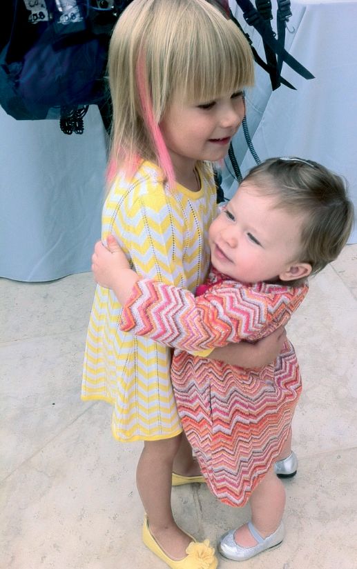 Stella hugging her cousin Simone at the baby shower for baby Hattie Courtesy - photo 4