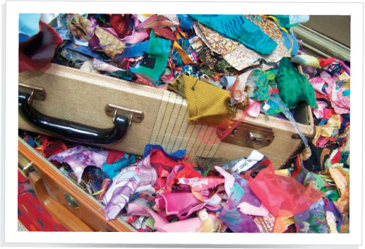 Tiny pieces of fabric are tossed into old suitcasesmy scrap-cases Larger - photo 6