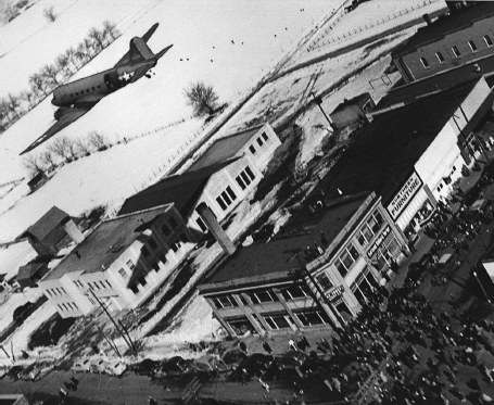 Home on leave Lt Halvorsen flies over Garland Utah dropping candy - photo 4