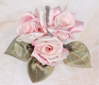 Three small ribbon roses and leaves are combined together to make a corsage for - photo 12