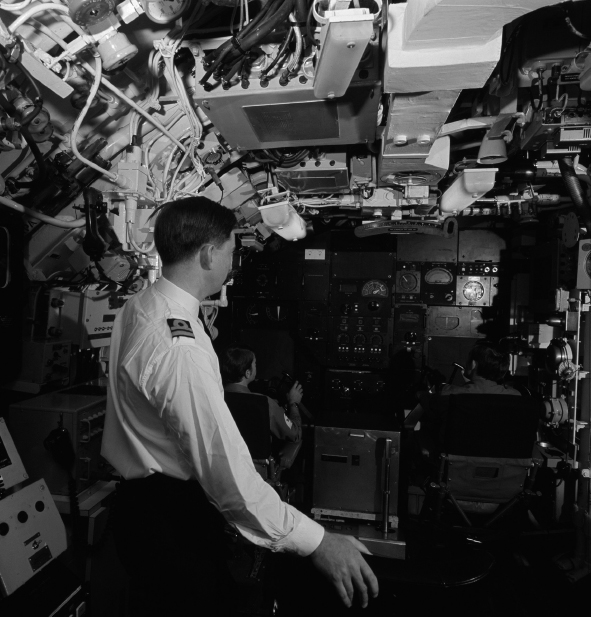 Two planesmen guide the nuclear submarine HMS Revenge somewhere deep in the - photo 15