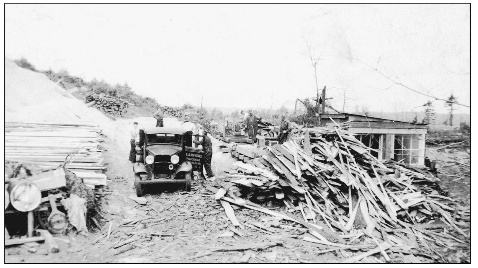 A truck from EA Rivers Trucking of Pascoag Rhode Island loads wood at the - photo 8