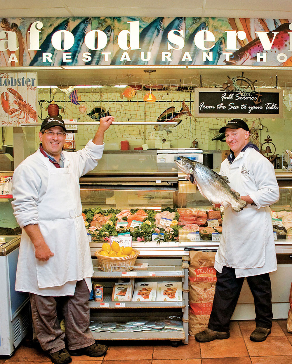 Fishmongers Jay Silver and Frank Tornetta at their retail fish counter A - photo 2