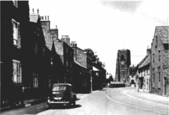 A postcard of Kirkgate in Thirsk looking up to the parish churchand by - photo 14