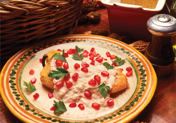 The dish shown above chiles en nogada adorned with the red white and - photo 11