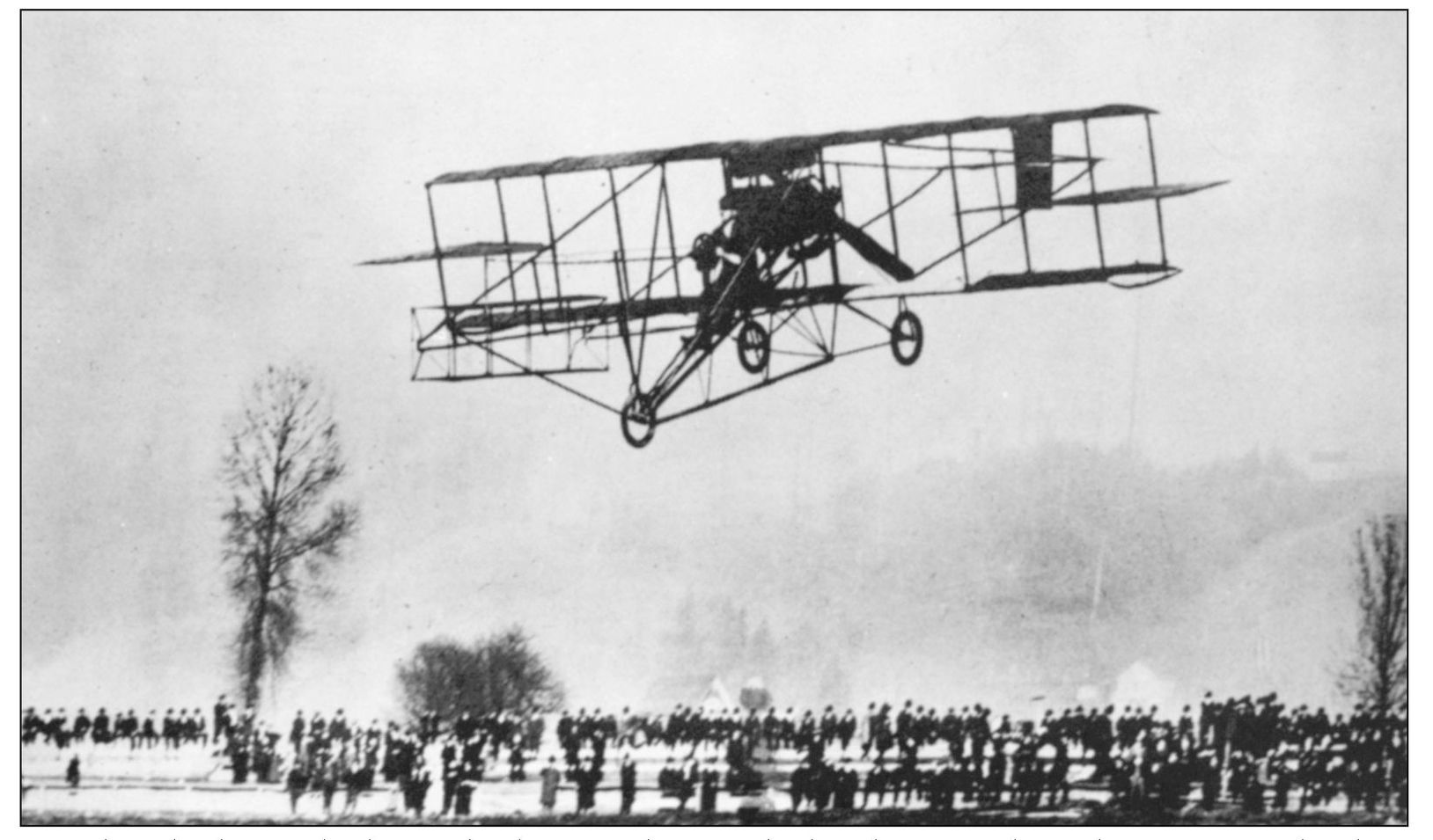 Over hundreds of onlookers Charles Hamilton guides his flying machine down to - photo 9