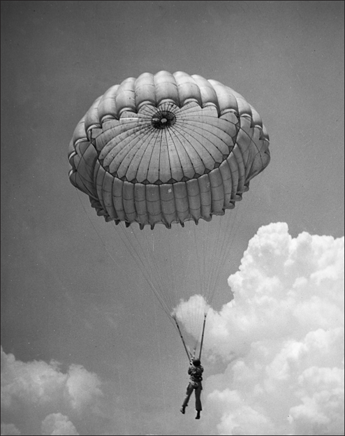 A jumper tugs the front side of his chute to move forward as the wind pushes - photo 11