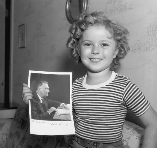 Shirley Temple holds an autographed portrait of FDR November 14 1935 - photo 5