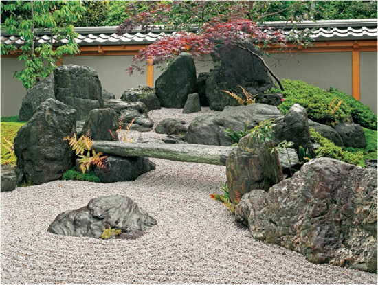 Raked gravel rocks and plantings combine in a scene of a river flowing from a - photo 1