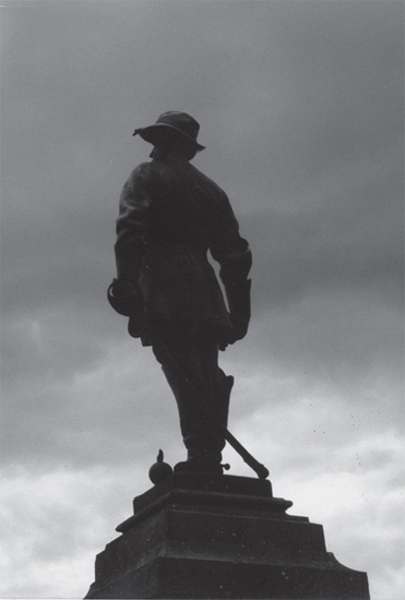 A statue of Stonewall Jackson stands over his gravesite in Lexington Virginia - photo 5