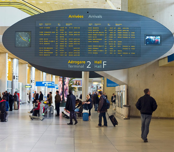 Arrivals board displaying flight information in Terminal 2 at Charles de Gaulle - photo 8