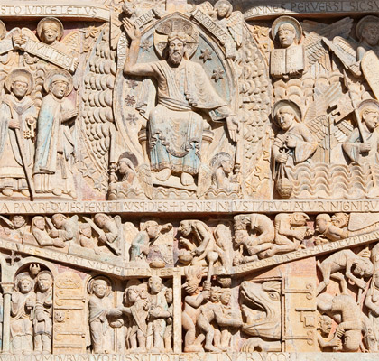 The carved tympanum of the Abbaye de Ste Foy Conques Central France has - photo 5