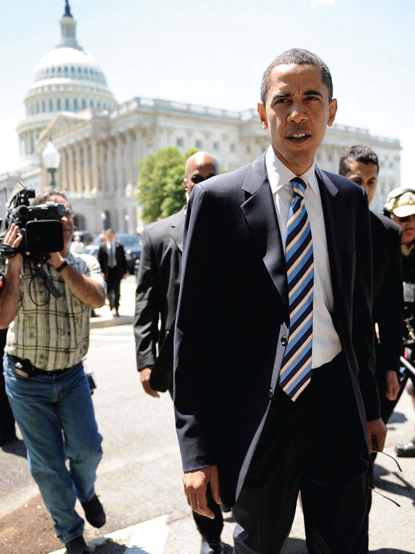 Obama walks back to his office on Capitol Hill after a series of votes on the - photo 4