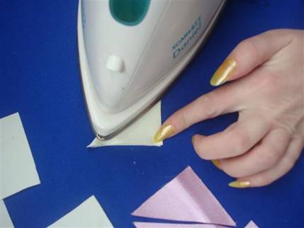 -5- Now that ironing is over you have 10 triangles of the diagonally folded - photo 6