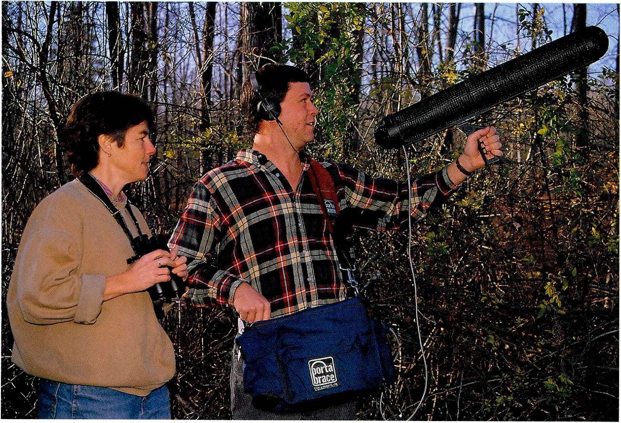 Scientists use a large microphone to focus in on the sound of the birds they - photo 5