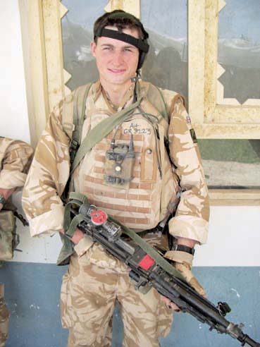 Nineteen-year-old Private Chris Gray with his Minimi light machine-gun in - photo 2