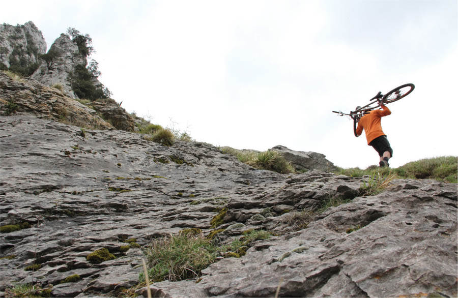 The sports founders pushed and carried their basic bikes up mountains in the - photo 5