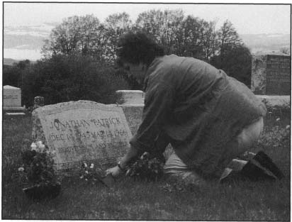 Planting flowers on a grave is a common ritual which is what Im doing around - photo 6