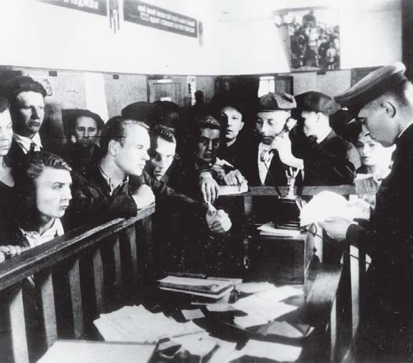 Volunteers registering for military service at an enlistment office during the - photo 2