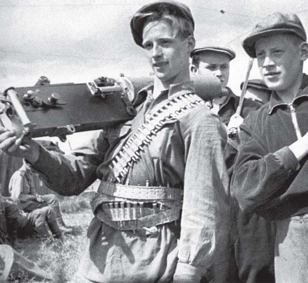 Young Leningrad workers undergoing military training The lad with ammo belts - photo 3