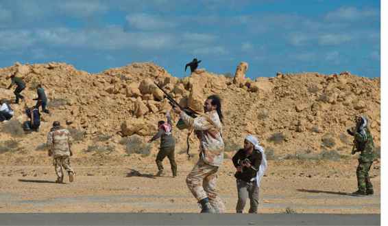 Opposition troops fire at a government helicopter as it sprays the area with - photo 4