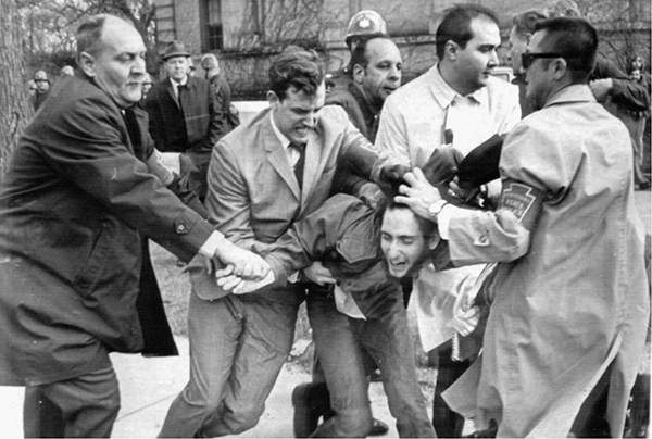 Mike Simmers second from left subdues a demonstrator on the PSU campus April - photo 19