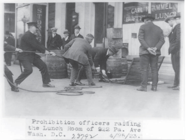 A police raid confiscating illegal alcohol during the 1920s Many firearms - photo 2