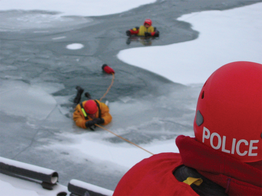 Figure J Rescuer using a throw bag to pull an immersed subject to shore The - photo 11