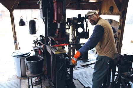 The author Don Fogg shown here taking a sword billet to the power hammer - photo 4