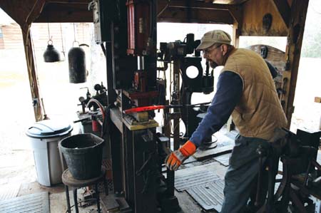 The initial forging step is to prepare the overall shape of the sword blade - photo 6