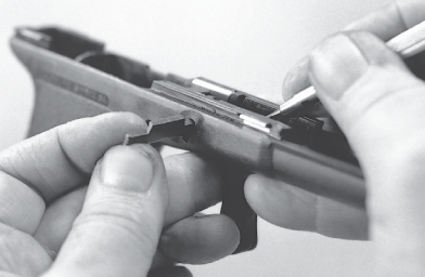 The barrel locking block can be pried gently upward and removed Inserting - photo 23