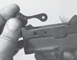 A cross pin at the lower front of the trigger group pivots and retains the bolt - photo 13