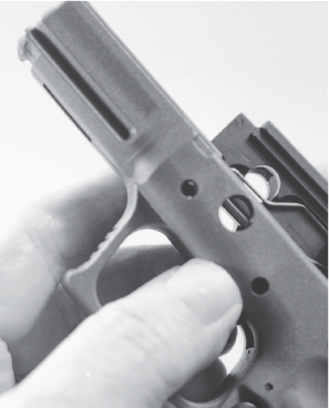 Move the rear of the trigger bar slightly inward and take out the trigger - photo 24