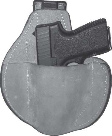 Polymer-framed 9mm Kahr PM9 rides inside and below the waistband and was - photo 1