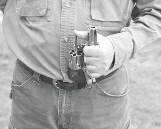 Once the cylinder is open work your hand forward so that youre holding the gun - photo 15