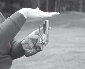 Flatten your right hand and swiftly strike the ejector rod one time with your - photo 1