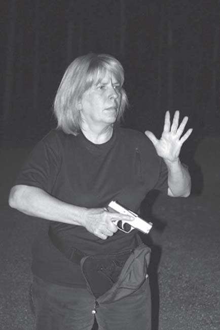 Gail Pepin 2-time FloridaGeorgia regional IDPA woman champion demonstrates - photo 4