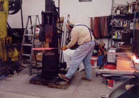 Devin Thomas draws out a bar on a 150-pound air hammer My first exposure to - photo 2