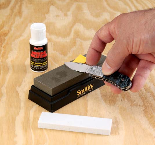 The Smiths 2-Stone Sharpening Kit comes with a small plastic angle guide that - photo 5