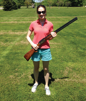 RESEARCHER LINDSEY BREUER POSES WITH A KRIEGHOFF K-80 30-INCH SHOTGUN ON THE - photo 3